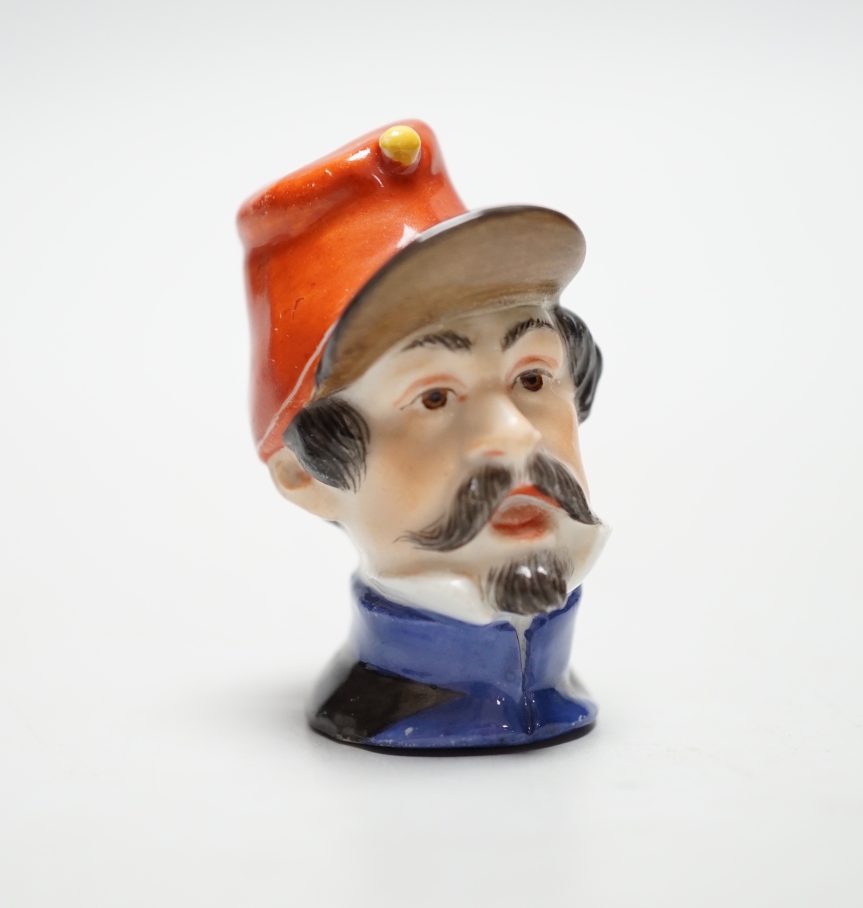 A Meissen bottle stopper or cane handle, modelled as a soldier’s head, 4.5cm